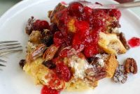 Indulgent Overnight Eggnog French Toast Bake with Tart Cranberry Maple Drizzle