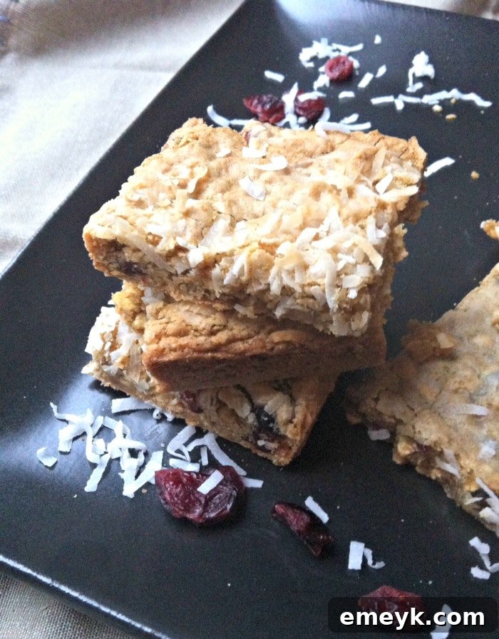 Artfully arranged Chewy Coconut Cranberry Oatmeal Bars, highlighting their appeal as a homemade, nutritious treat.