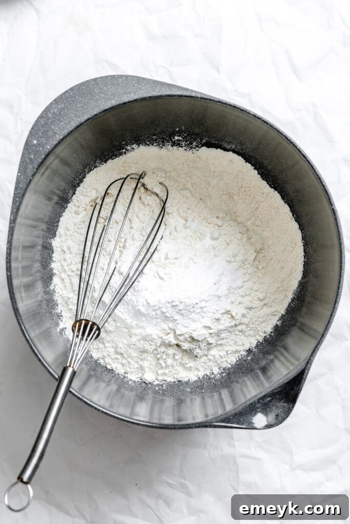 Easy Snickerdoodle Recipe dry ingredients in a separate bowl: flour, cream of tartar, baking soda, and salt.