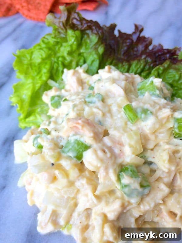 Lightened Chicken Salad with creamy yogurt dressing, served in a bowl with fresh herbs