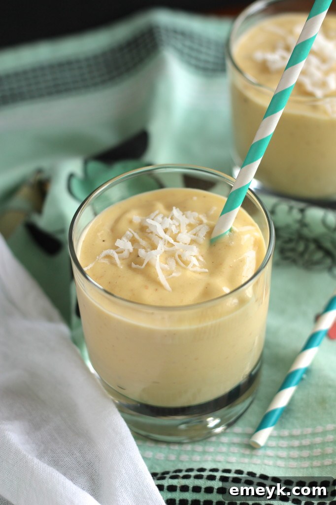 Mango Coconut Paradise 4 Close-up of a creamy Coconut Mango Smoothie, highlighting its smooth texture and rich color.
