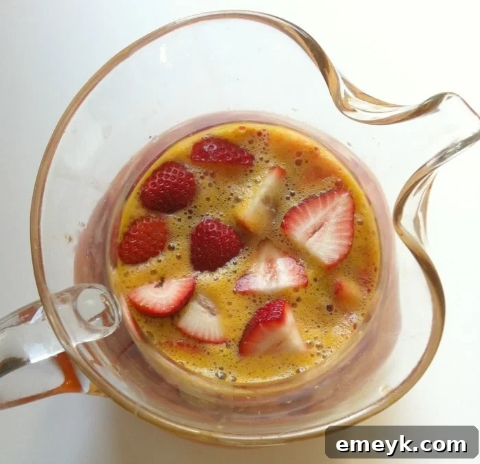 Close-up of Strawberry Clementine Sangria with Fresh Fruit Garnish