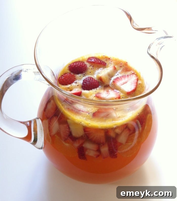 Pitcher of Strawberry Sangria with Sliced Fruit