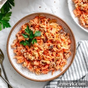 A beautifully presented Carrot Raisin Salad in a serving bowl, ready to be enjoyed as a refreshing side dish.