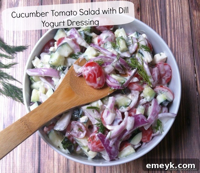 Vibrant Cucumber Tomato Salad with Dill Yogurt Dressing ready to be served