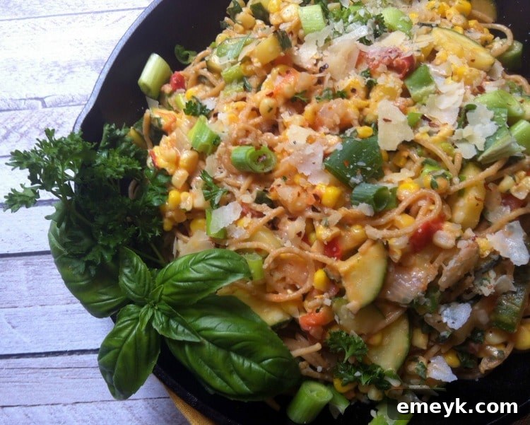 Close-up of a vibrant Garden Pasta Skillet filled with colorful summer vegetables and pasta, ready to serve.