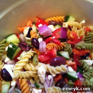 Featured image of a bowl of ready-to-eat Greek Pasta Salad