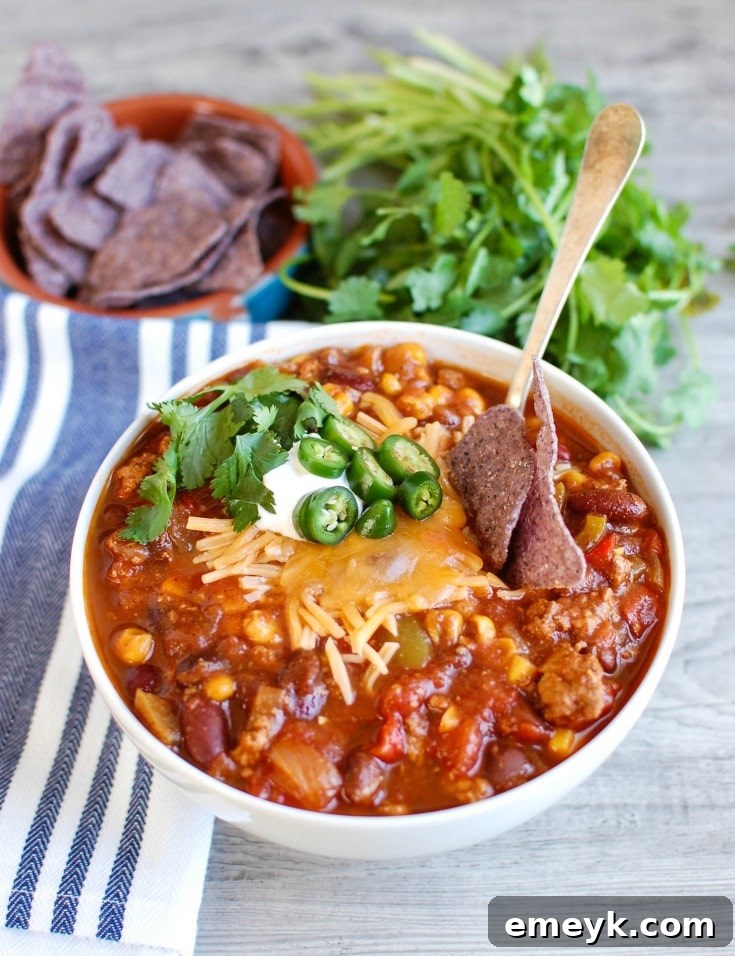 Hearty Slow Cooked Turkey Chili 4 Slow Cooker Turkey Chili served in a bowl with tortilla chips on the side