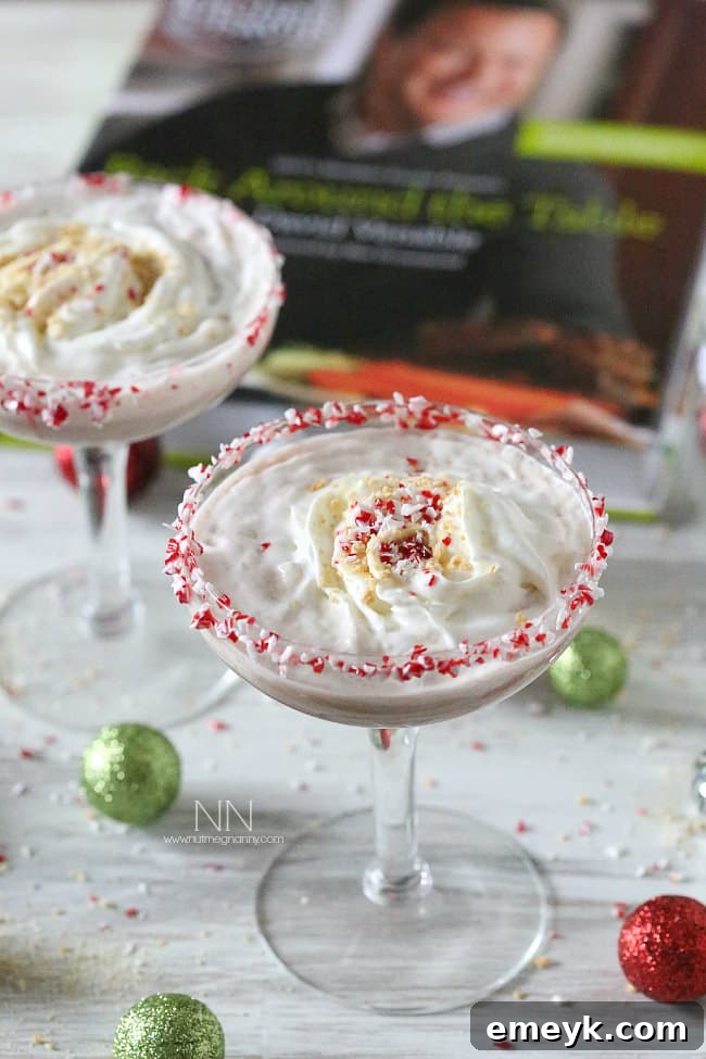 41 Festive Season Sips 12 A festive Peppermint S'mores Martini, garnished with a chocolate-rimmed glass and a toasted marshmallow, perfect for holiday indulgence.