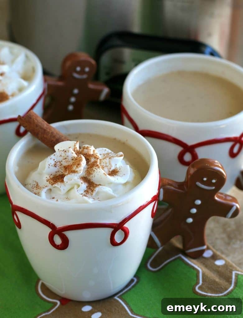 41 Festive Season Sips 6 A festive image of slow cooker eggnog lattes topped with whipped cream and cinnamon, ideal for a holiday brunch.