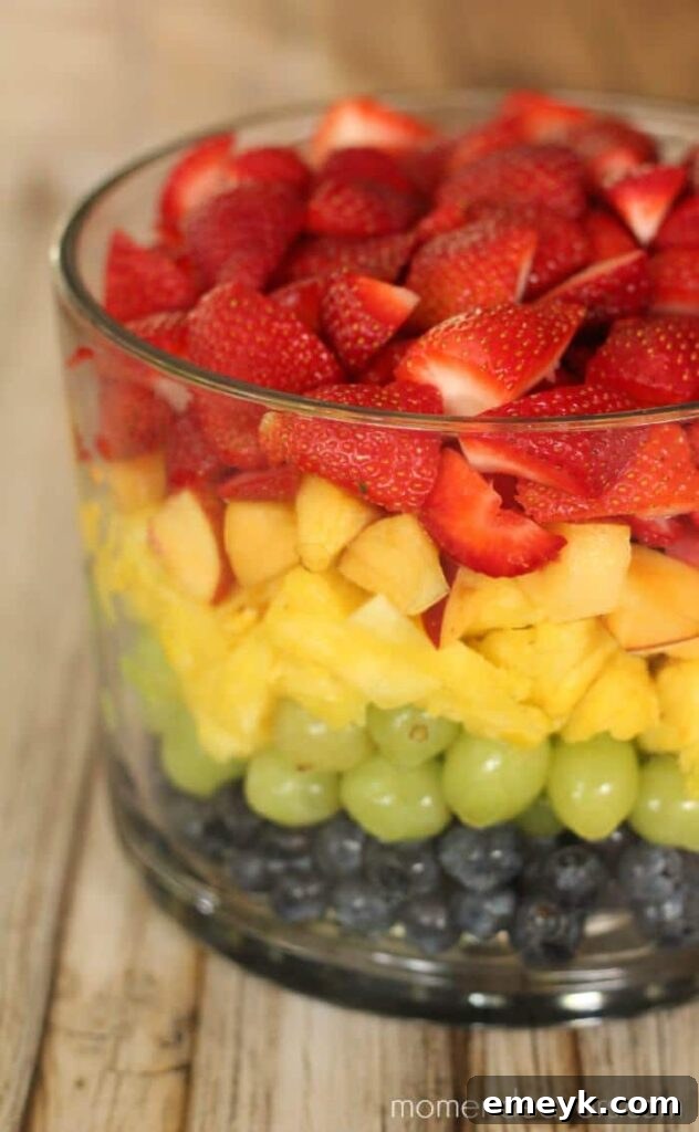 Embrace the Colors of Wellness 46 Layered Rainbow Fruit Salad, beautifully arranged in distinct colorful layers