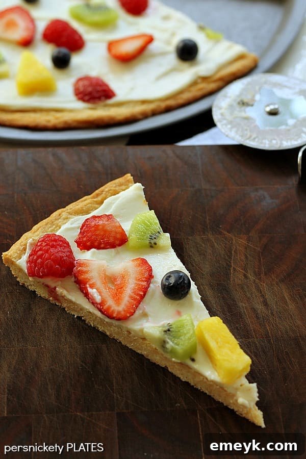 Embrace the Colors of Wellness 48 Fruit Pizza, a dessert pizza topped with fresh, colorful fruits