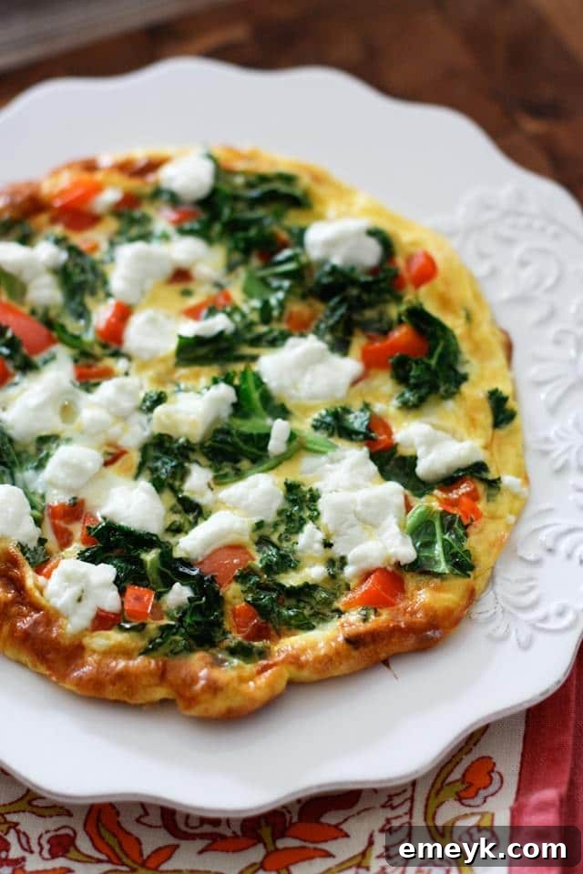 Embrace the Colors of Wellness 23 Kale, Red Pepper and Goat Cheese Frittata, a fluffy and colorful egg dish