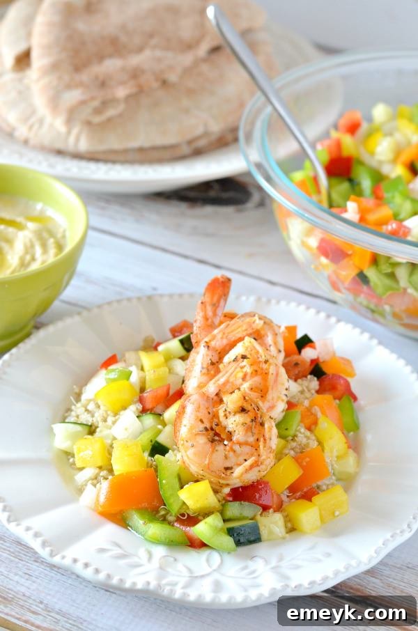 Embrace the Colors of Wellness 17 Shrimp and Israeli Pepper Salad with Pita Bread, a fresh and colorful seafood salad