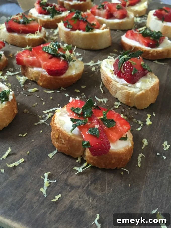 Velvet Strawberry Crostini with Mint and Zesty Honey 3 Overhead shot of Strawberry Mint Crostini beautifully arranged on a serving platter.