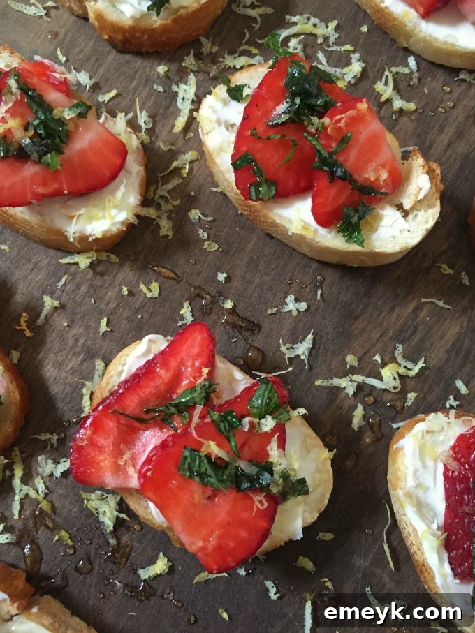 Velvet Strawberry Crostini with Mint and Zesty Honey 5 Artfully arranged Strawberry Mint Crostini with a focus on the fresh mint garnish.