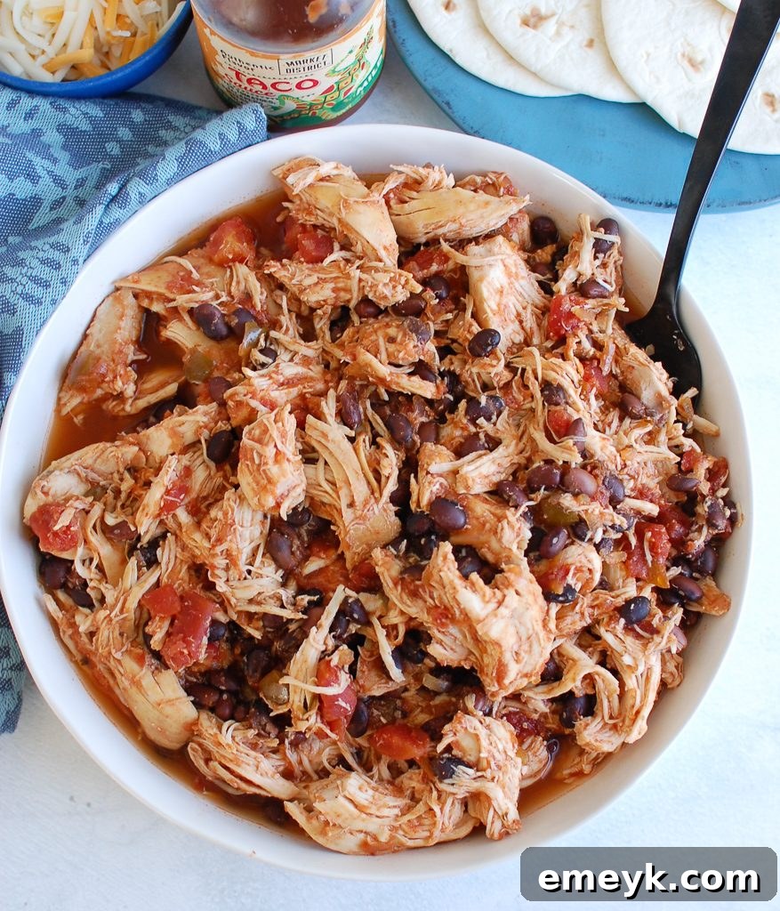 Set It and Forget It Shredded Chicken 3 Slow Cooker Shredded Chicken with fork pulling chicken