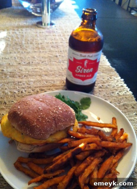 Juicy Grilled Spicy Turkey Burger with melted cheese, fresh tomato, and lettuce on a toasted bun