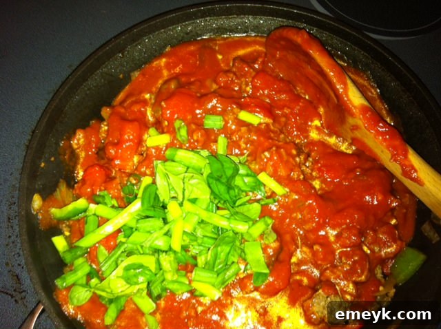 Goulash sauce with herbs and meat simmering