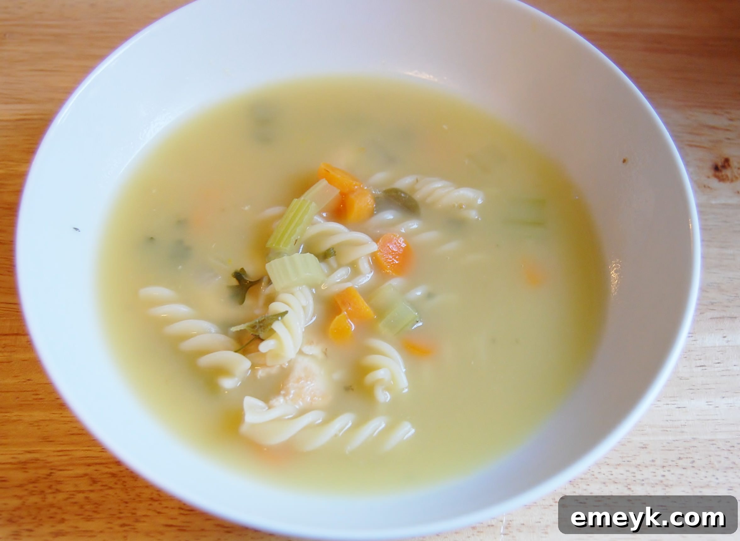 Classic Chicken Noodle Soup, brimming with noodles, chicken, and vegetables.