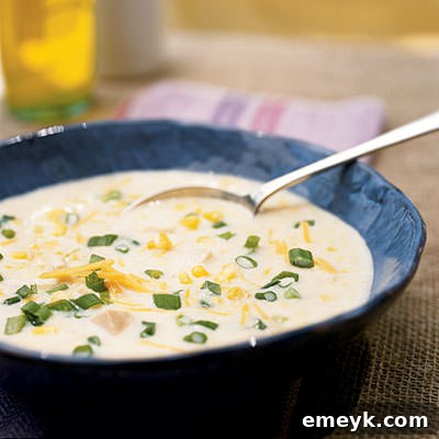 Creamy Chicken Corn Chowder, garnished with fresh herbs, perfect for a cozy fall meal.