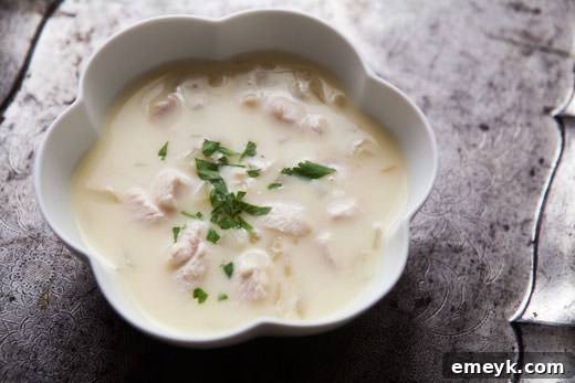 Classic Greek Avgolemeno Soup, a lemon-egg broth with rice and chicken.