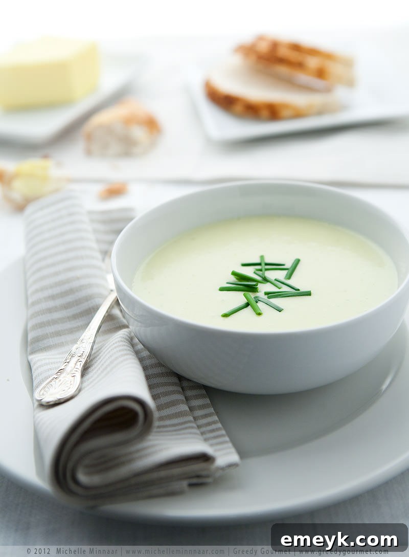 Smooth and creamy Potato Leek Soup, garnished with fresh chives.