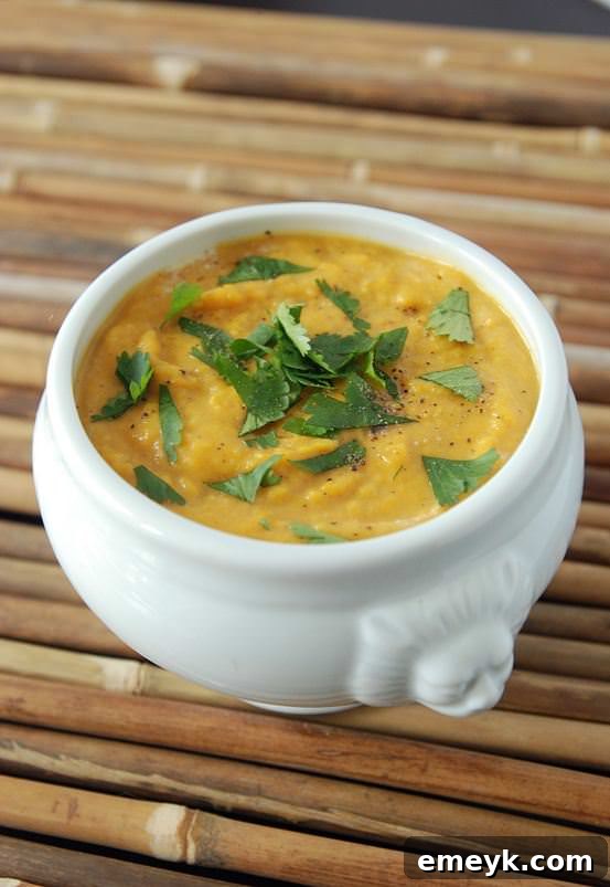 Creamy Sweet Potato Coconut Curry Soup, garnished with fresh cilantro.