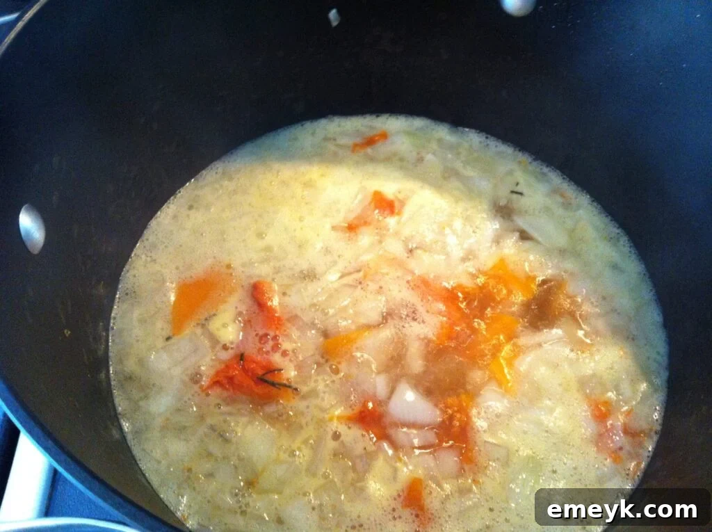 Butternut Squash Soup Simmering Butternut squash soup simmering gently on the stovetop