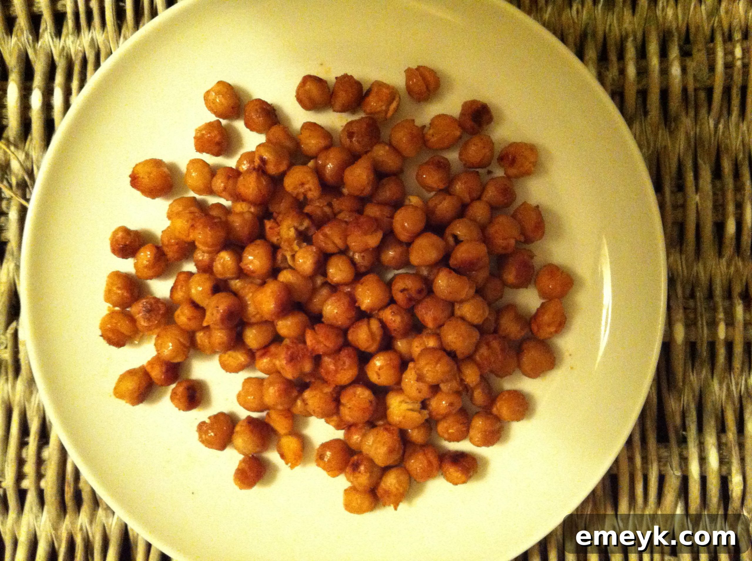 A beautiful plate of finished roasted chickpeas, ready to be served and enjoyed as a delicious and healthy snack.