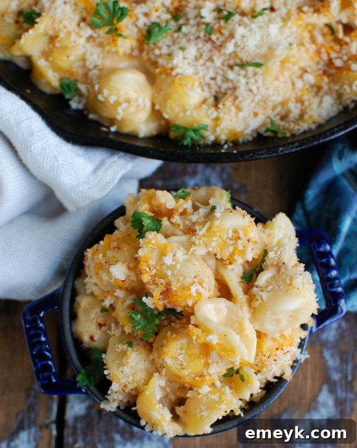Small bowl of baked mac and cheese with panko breadcrumbs, showcasing a perfect serving.