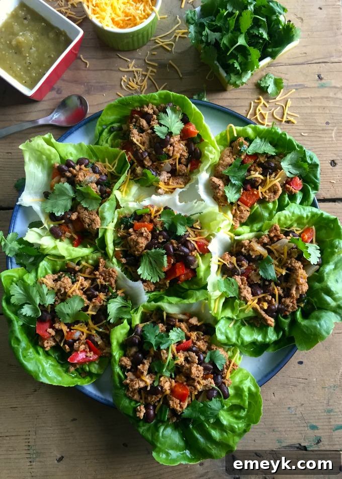 Crisp Mexican Turkey Wraps 5 A close-up of the Mexican turkey filling in a skillet, showcasing the rich colors and textures of the ingredients.