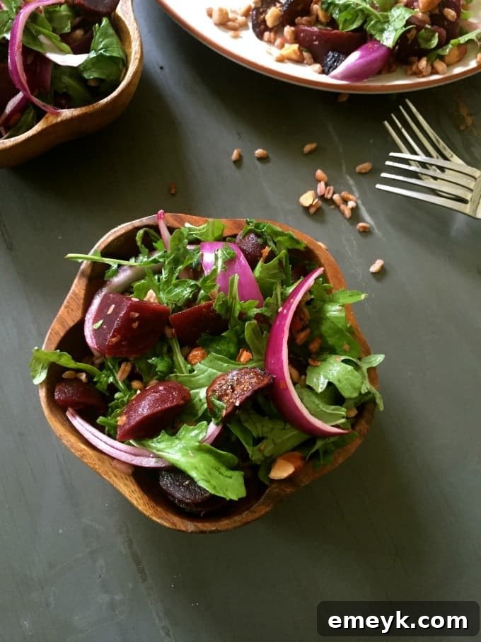 Hearty Farro Salad with Roasted Beets and Arugula 2 Farro Roasted Beet Arugula Salad - A close-up view of the vibrant salad with farro, roasted beets, arugula, and figs, perfectly dressed.