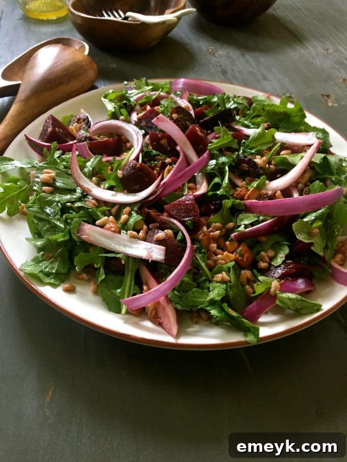 Hearty Farro Salad with Roasted Beets and Arugula 3 Close-up of Farro Roasted Beet Arugula Salad, showcasing the texture of farro and the rich color of beets.