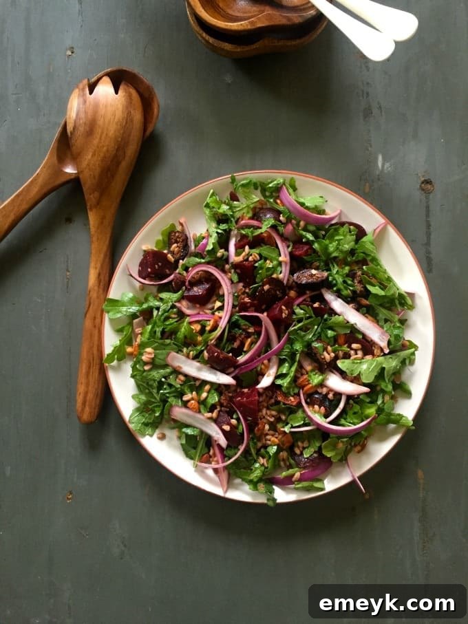 Hearty Farro Salad with Roasted Beets and Arugula 6 Farro Roasted Beet Arugula Salad served in a white bowl, showing its fresh and colorful ingredients.