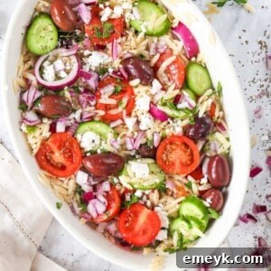 A top-down view of a fresh Greek Orzo Pasta Salad.