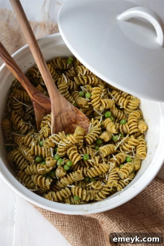 Vibrant Spring Pea Pesto Pasta Salad featuring a homemade pea pesto.