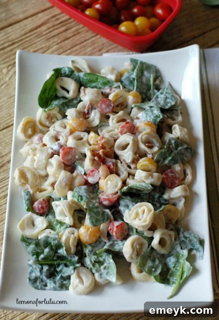 Hearty BLT Tortellini Salad featuring bacon, lettuce, tomatoes, and tender tortellini.