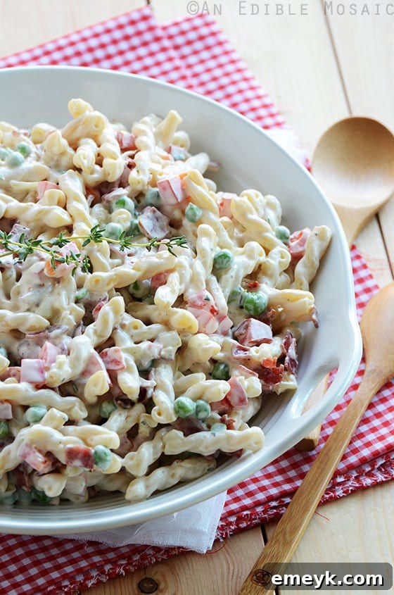 Classic Creamy Pasta Salad with Bacon, Peas, and Bell Peppers, a family favorite.