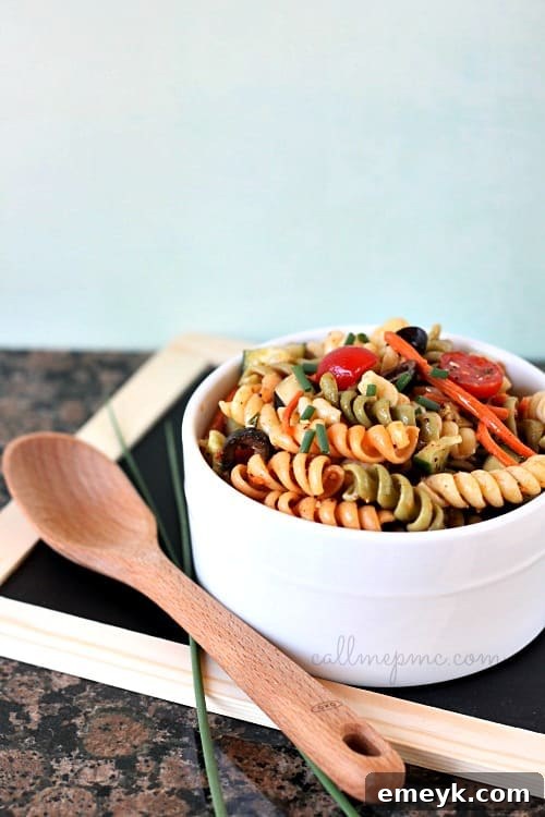 Classic Tri-color Vegetable Pasta Salad, packed with fresh garden veggies.