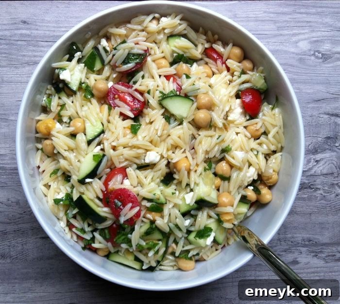 Light and fresh Summer Orzo Pasta Salad packed with crisp vegetables and a zesty dressing.