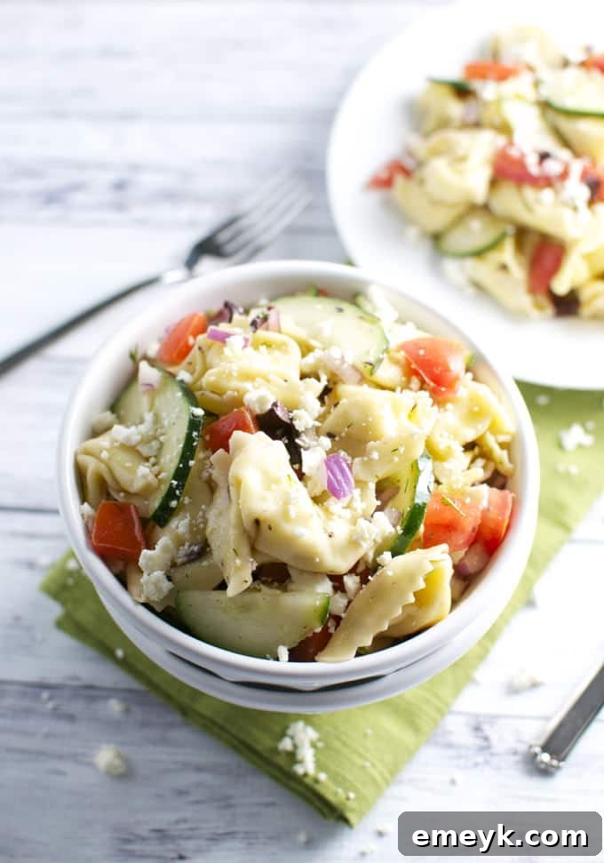 Hearty Greek Tortellini Pasta Salad featuring cheese tortellini, olives, feta, and vegetables.