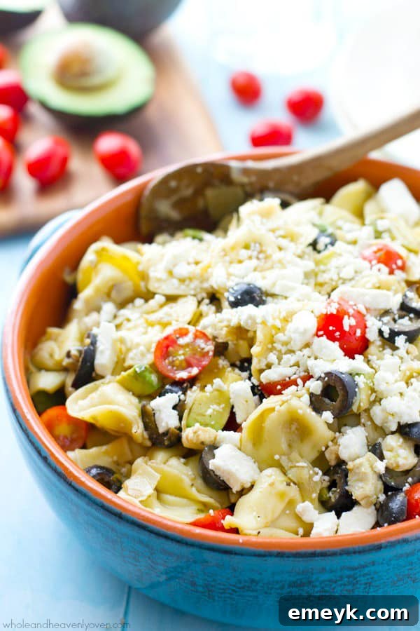 Sophisticated Mediterranean Tortellini Pasta Salad with artichokes and sun-dried tomatoes.