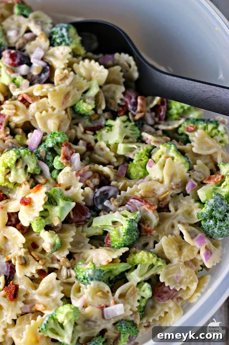 Refreshing Broccoli and Grape Pasta Salad featuring crispy bacon and a creamy dressing.