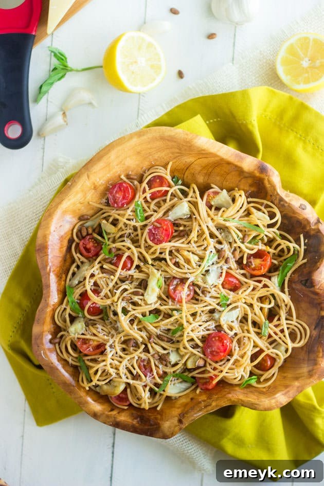 Healthy Pasta Salad with tangy artichokes and a zesty lemon dressing.