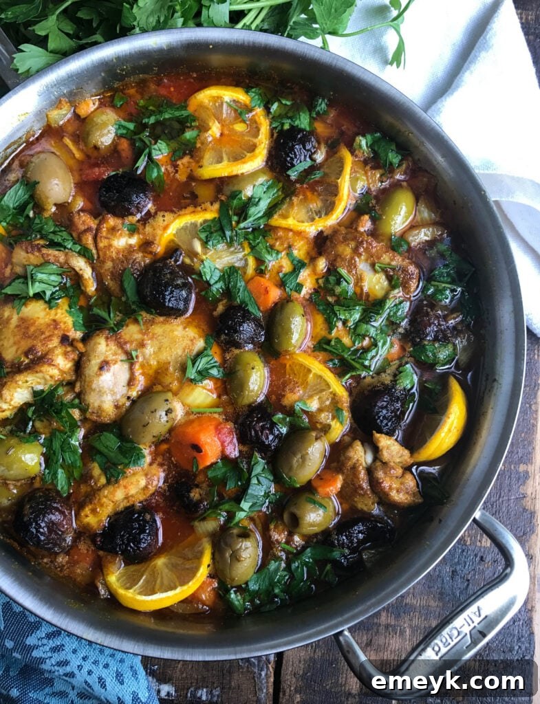 Side view of Moroccan Chicken Thighs with rich sauce and vegetables