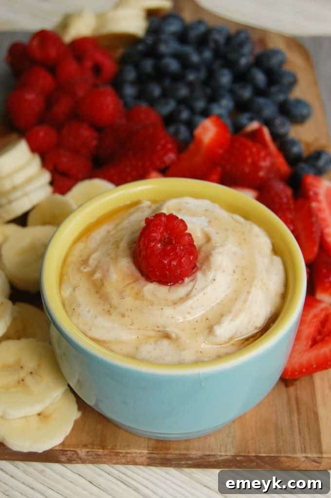 Close-up of Yogurt Fruit Dip in a ceramic bowl, showcasing its smooth, creamy texture.