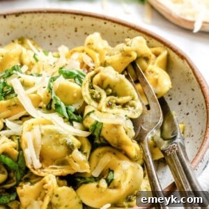 Pesto Tortellini Image 1200 x 1200 - A close-up of the finished baked dish, golden and cheesy.