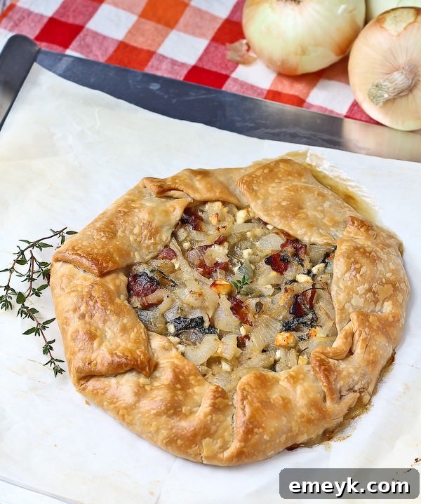 Delicious Vidalia Onion Tart with bacon, crumbled feta, and fresh kale.
