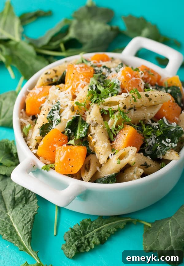 Pesto Penne Pasta with roasted butternut squash, tender kale, and parmesan.